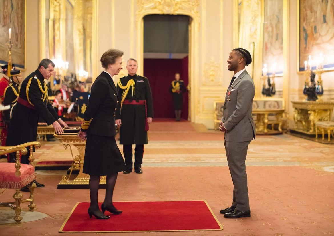 Andy Ayim receiving his MBE at an investiture ceremony